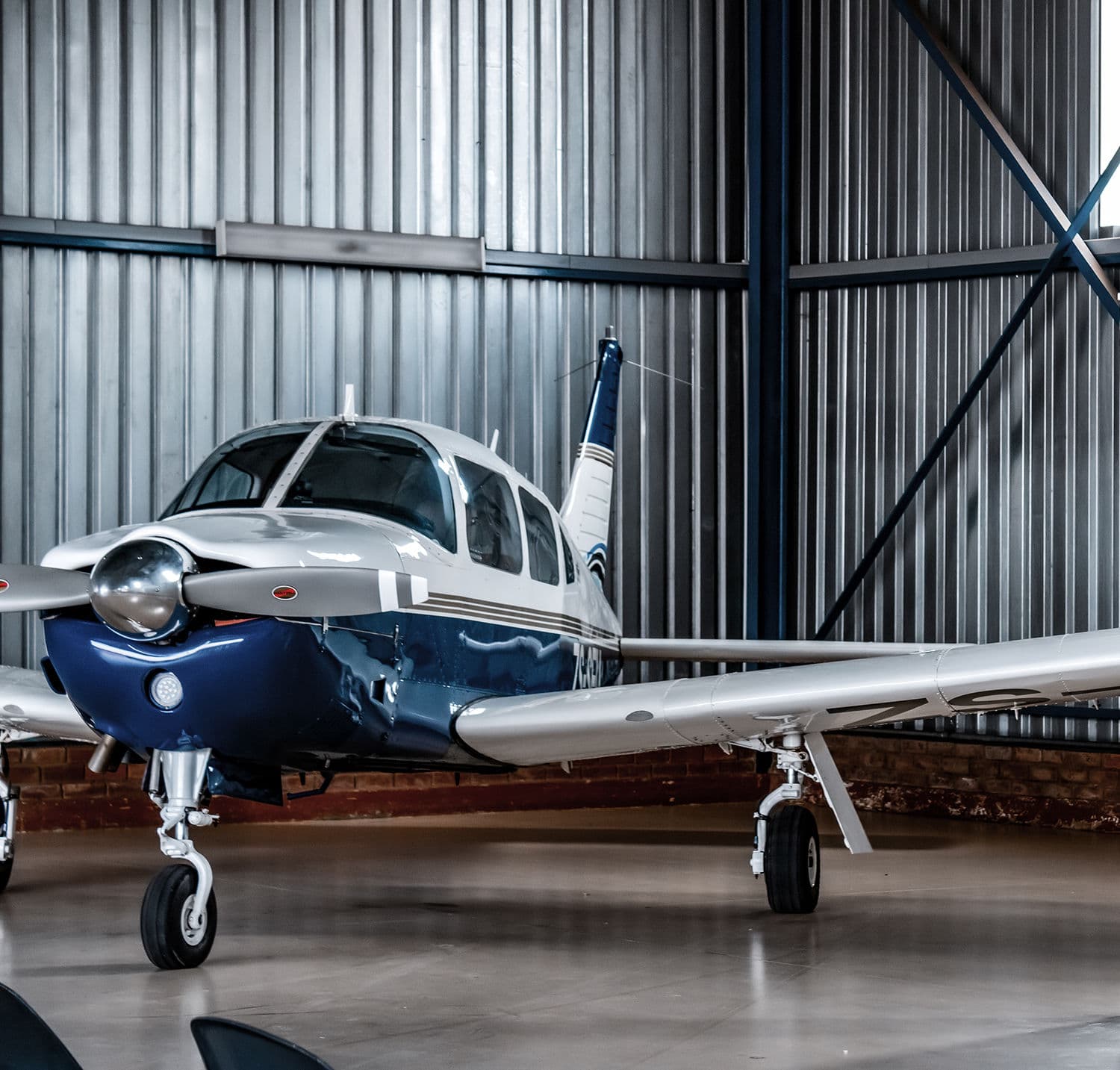 A Piper Arrow inside the hangar