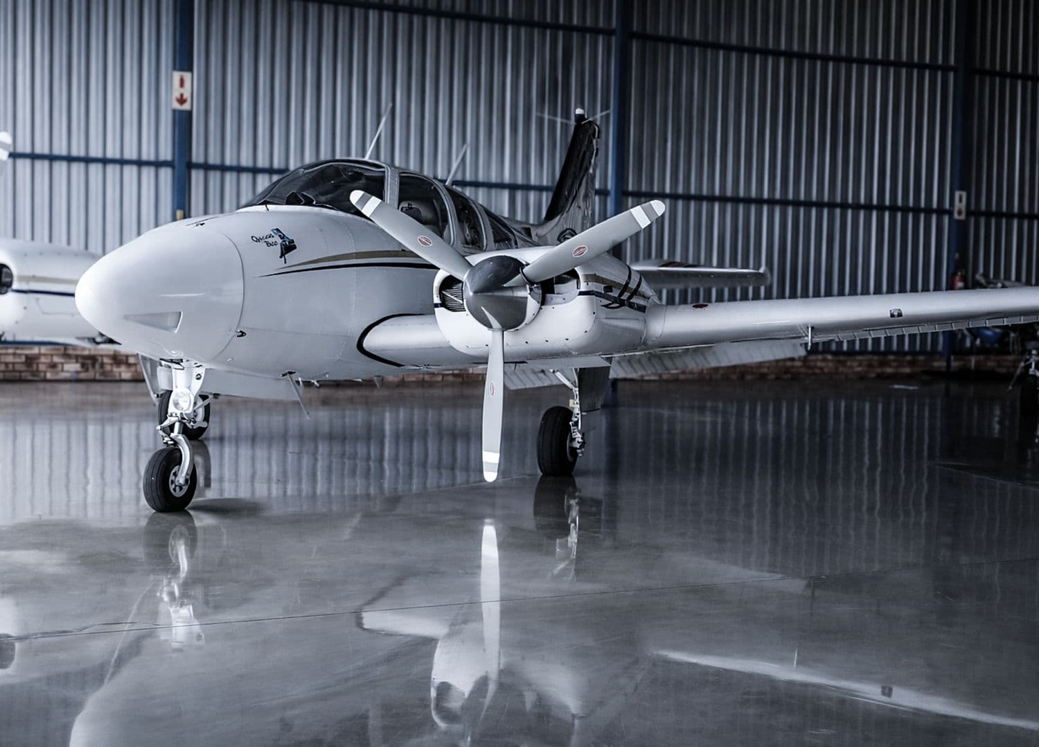 A Beechcraft Baron 55 on the polished hangar floor
